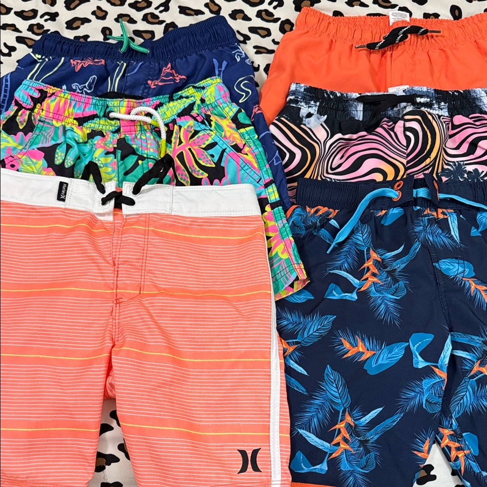 6 pair of boy swim trunks size 6-7 
Multiple brands.